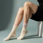 Pink Sprinkle Smiley Socks by EmotiForce — beige cotton socks with pink cuff and fluffy smiley patch